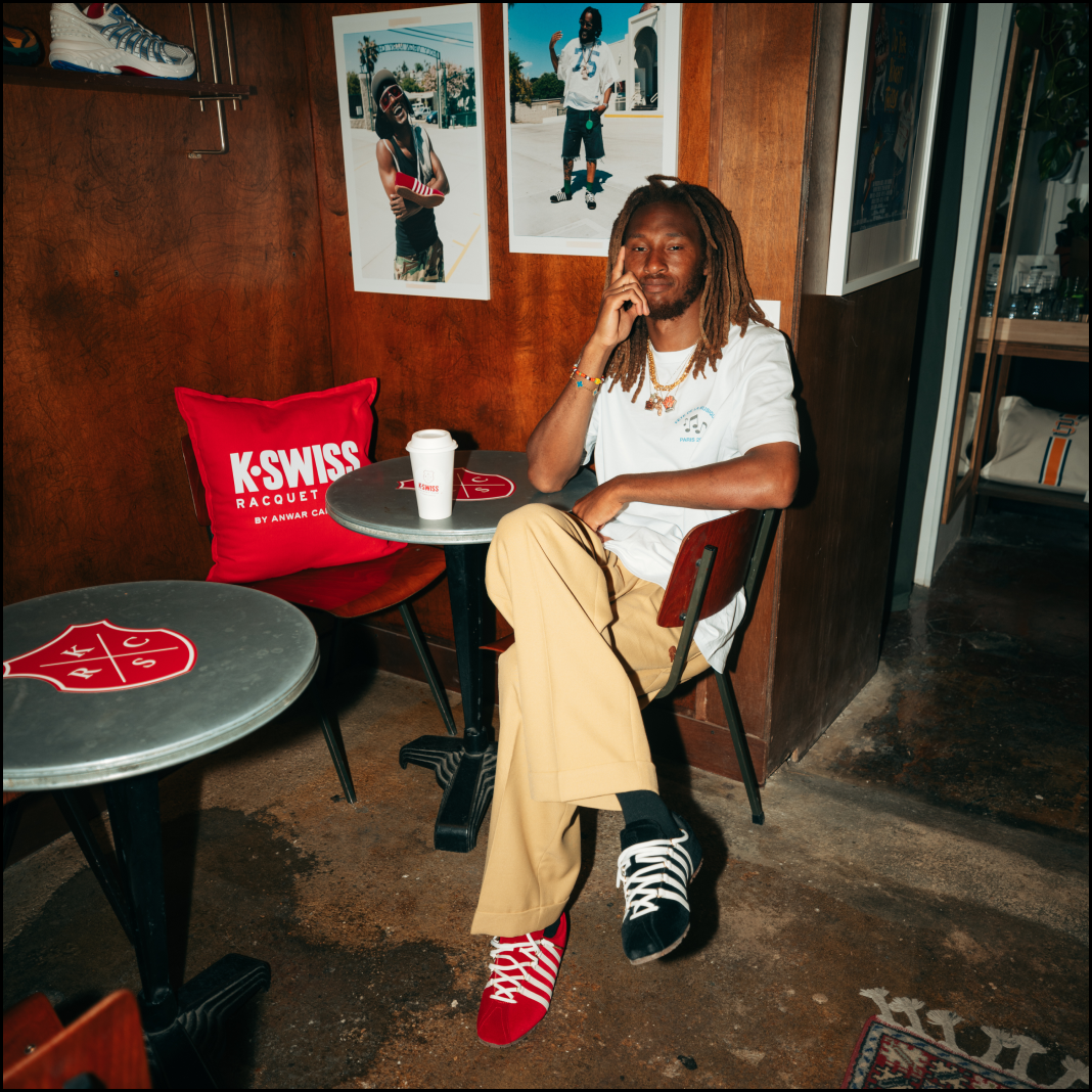 Anwar sitting in KSRC cafe with Before the Classics  KSRC shoes in Red and Black