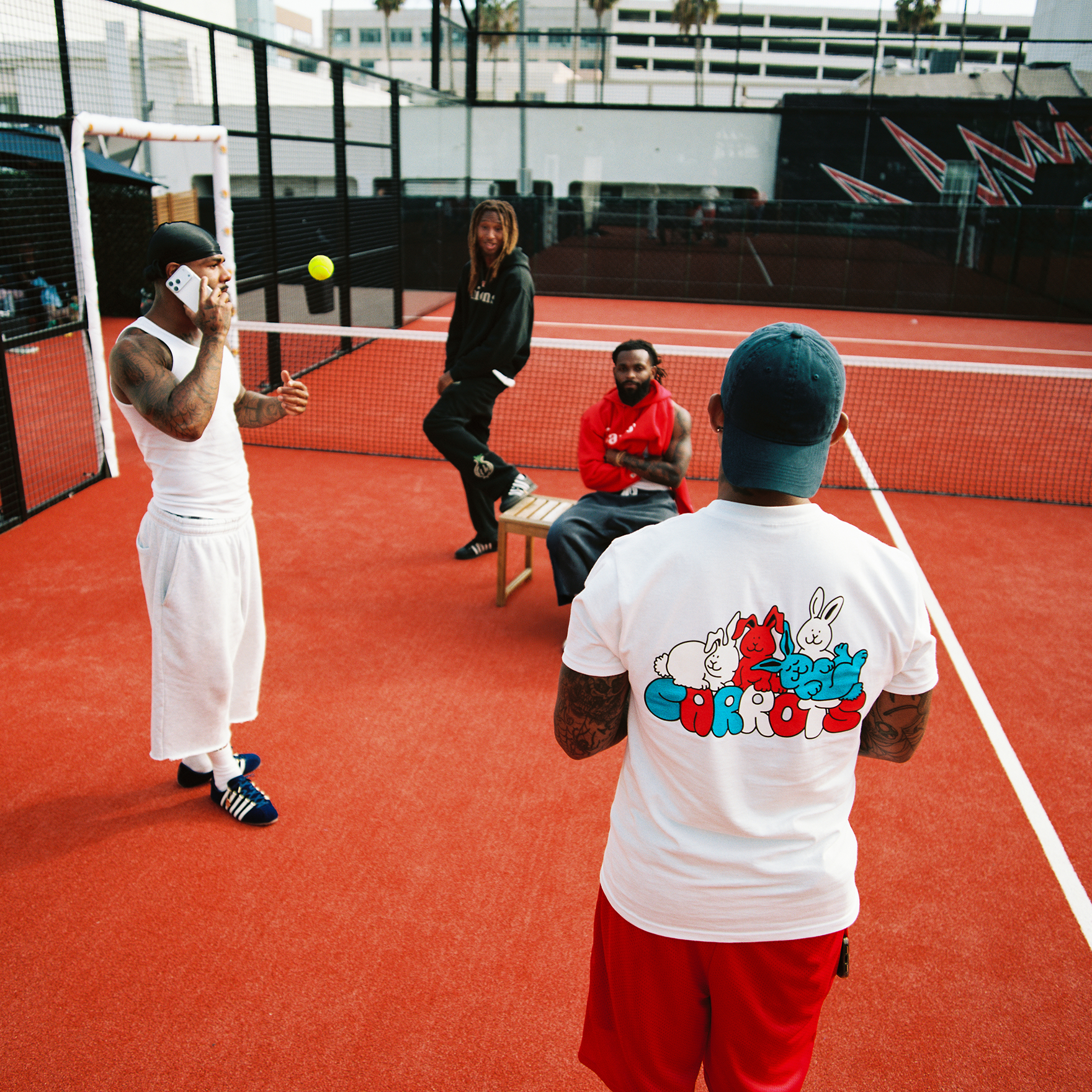 Group of friends hanging out at the Padel Court wearing KSRC shoes